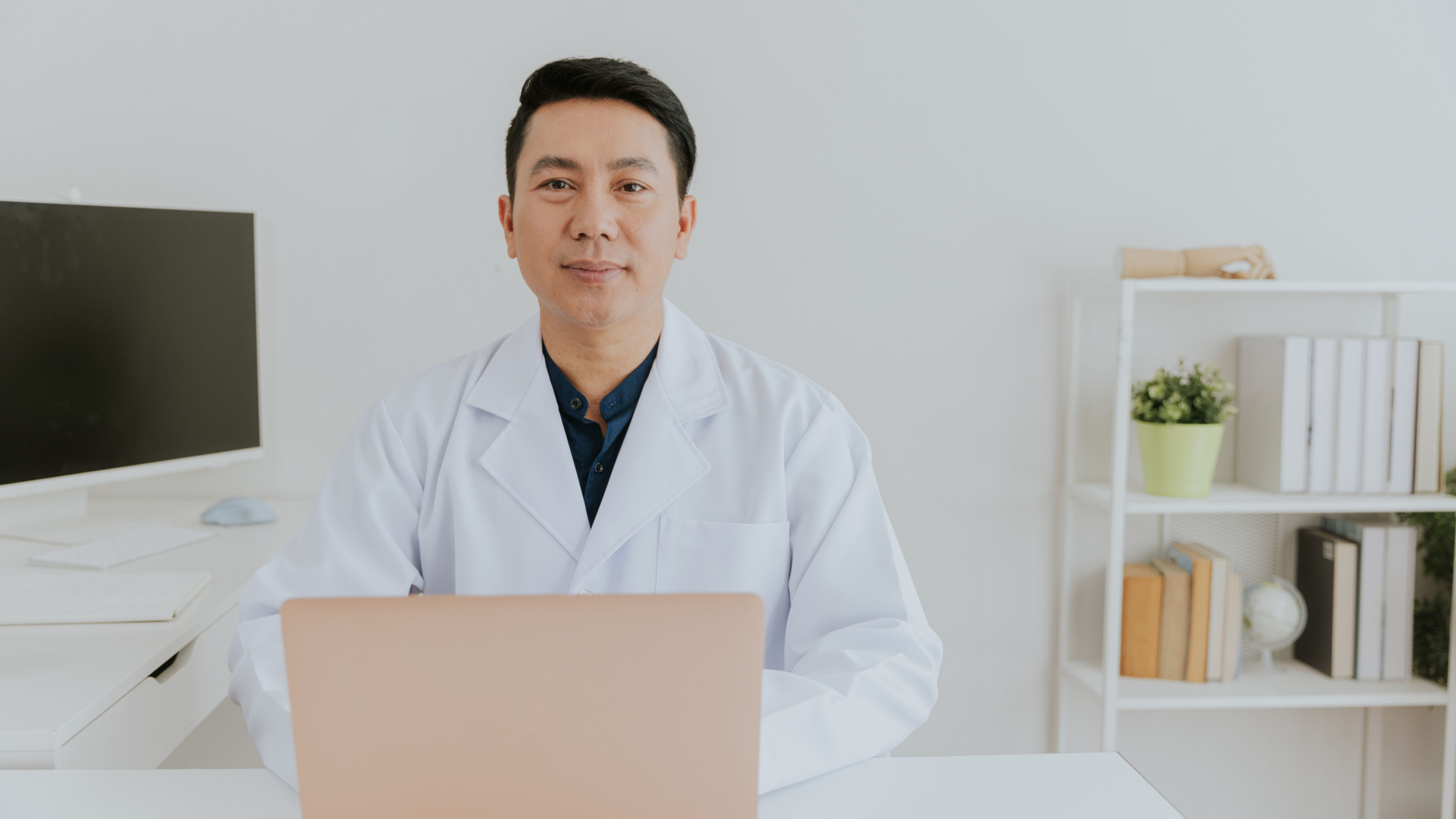 Healthcare professional researching patient financing alternatives at a desk